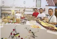  ??  ?? Rod Tenorio with his former students Peter Roxas and Michael Cabanting at the Panaderia.