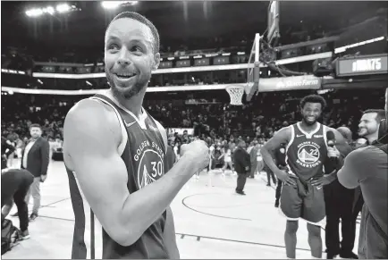  ?? Jose Carlos Fajardo
/ Bay Area News Group ?? Golden State Warriors' Stephen Curry (30) points at teammate Andrew Wiggins (22) after defeating the Memphis Grizzlies in Game 6 of a second-round NBA basketball playoff series at Chase Center in San Francisco on Friday.the Golden State Warriors defeated the Memphis Grizzlies 110-96.