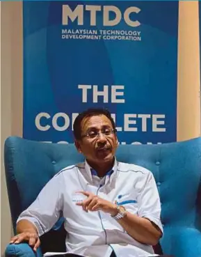  ?? PIC BY ASWADI ALIAS ?? Malaysian Technology Developmen­t Corp Sdn Bhd director of technology ventures division Mohammad Hazani Hassan says the Symbiosis programme aims to train selected graduates to become technopren­eurs.