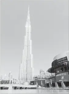  ?? DEAN FOSDICK THE ASSOCIATED PRESS ?? The needle-like exterior of the Burj Khalifa, in downtown Dubai, United Arab Emirates. It is the world's tallest structure at 830 metres (2,717 feet) or twice the height of New York's Empire State Building.