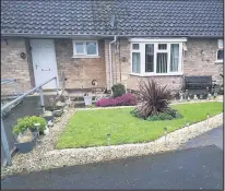  ??  ?? ■ Loughborou­gh woman, Maggie Green, of Burns Road, has been told to remove plants and decorative stones from the front of her bungalow by Charnwood Borough Council.