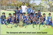  ??  ?? The champions with their proud coach Javed Sayeed