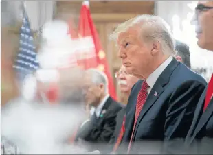  ?? AP PHOTO ?? President Donald Trump listens to China’s President Xi Jinping speak during their bilateral meeting at the G20 Summit, Saturday, in Buenos Aires, Argentina.