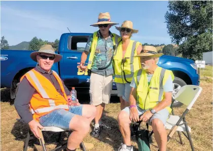  ?? Photo / HC Post ?? Trying to hide from the midday sun and the limelight were some familiar faces — Noddy Watts and partner Andrea with other longtime Repco Beach Hop volunteers at Dance Farm.