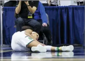  ?? ROBERT FRANKLIN — THE ASSOCIATED PRESS ?? Notre Dame’s Brianna Turner reacts to a knee injury against Purdue on Sunday.
