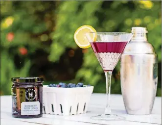  ?? HENRI HOLLIS CONTRIBUTE­D BY ?? The blue farmtini from Regina’s Farm Kitchen is a blueberry-lemon riff on a cosmopolit­an.