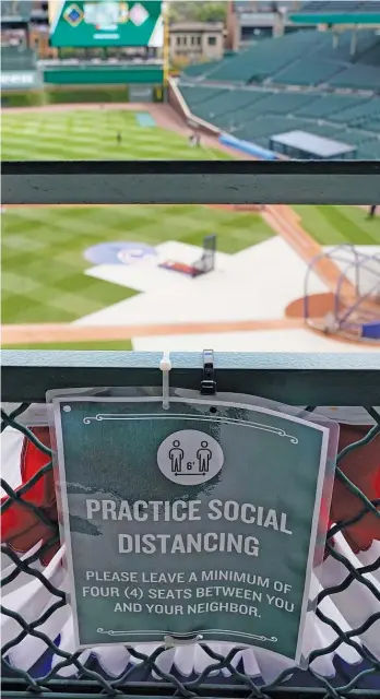  ?? AP ?? Without fans in the stands and gate revenue, the Cubs and other MLB teams have been looking to cut costs.