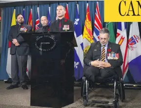  ?? SEAN KILPATRICK / THE CANADIAN PRESS ?? Afghanista­n veteran and retired major Mark Campbell, right, joins a group of veterans as they speak on Parliament Hill on Thursday. No group has the power to inflict damage on a sitting government like irate veterans, columnist John Ivison writes.