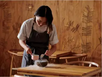  ?? ?? Chef Brianna Kim at work inside Alice, the high end vegan restaurant she opened in 2019. Earlier this year, Kim won first place at the Canadian Culinary Championsh­ips