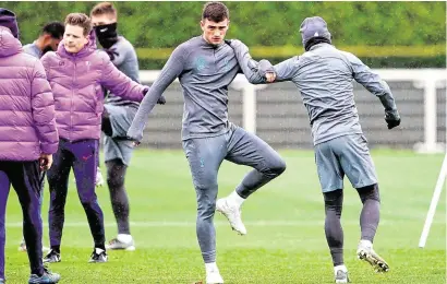  ??  ?? Irish teenager Troy Parrott warms up during Tottenham’s training session yesterday – the Dubliner may make his Champions League debut against Bayern Munich tonight only days after getting his first taste of Premier League action