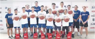  ??  ?? THE TOP SEVEN BOYS and top three girls who will advance to the National Training Camp in Manila from the Visayas with Jr. NBA camp coaches and facilitato­rs.