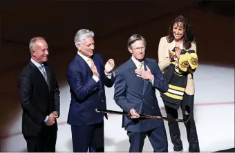  ?? ?? Bruins broadcaste­r Jack Edwards receives a gold stick from team owner Charlie Jacobs before the Bruins take on the Senators at the Garden on Tuesday. Edwards announced before the game he was retiring at the end of the season. (Staff Photo By Stuart Cahill/ Boston Her