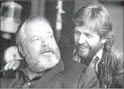  ?? Netf lix ?? ORSON WELLES, left, chats with filmmaker Gary Graver in the doc “They’ll Love Me When I’m Dead.”