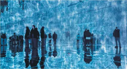  ?? Picture: AFP ?? TECHNO ART. Visitors view installati­ons by artist Roy Nachum at Mercer Labs Museum of Art and Technology in New York. Touted as a museum of art and technology, it is an ‘immersive and sensory’ space.