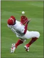  ?? MATT SLOCUM — THE ASSOCIATED PRESS ?? Several outstandin­g defensive plays, like this catch by shortstop Didi Gregorius in the ninth inning, carried the Phillies to a 3-2, 10-inning victory over the Atlanta Thursday in the season opener.