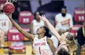  ?? Julio Cortez / Associated Press ?? Maryland’s Diamond Miller goes up for a shot against Indiana’s Grace Berger on Monday. Miller scored 20 points.