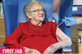  ??  ?? FIRST JAB
Annie Innes, 90, is vaccinated in Hamilton in December