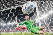  ?? ?? France’s Kylian Mbappe scores past Denmark’s goalkeeper Kasper Schmeichel his side’s second goal during the World Cup group D soccer match between France and Denmark, at the Stadium 974 in Doha, Qatar. (AP)