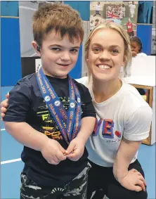  ?? Photograph: Graham West. ?? Lewis West and former British Paralympia­n swimmer Ellie Simmonds.