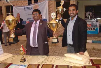  ??  ?? Rotarian Biswal (r) with another club member of Rotary Club of Lagos Palm Grove Estate displaying their trophies