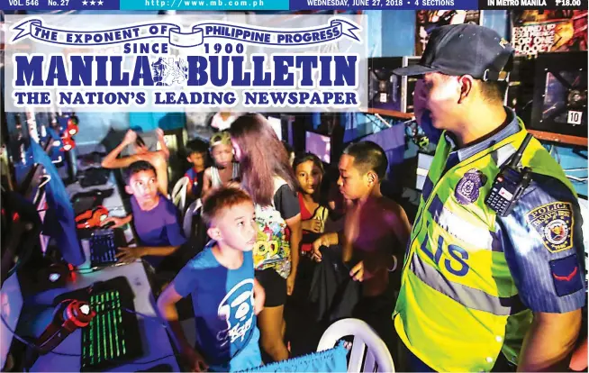  ??  ?? NO KID’S PLAY – Members of the Pasay City police round up these children, who were still playing at a computer shop on Estrella Street, Pasay City, late into the night. The police took custody of the children before releasing them to their parents, who were invited to the police station for questionin­g. President Rodrigo Roa Duterte has ordered the police to ‘take into custody’ children below 18 years caught loitering in the streets for their own safety, and release them the next day. (Jun Ryan Aranas)