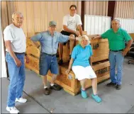  ?? Photo by Xyta Lucas ?? After setting up the panels for the new Fay Jones exhibit at the Bella Vista Historical Museum on Thursday morning, May 31, these volunteers then hauled the empty crates to the warehouse space donated by Cooper Communitie­s for the duration of the...