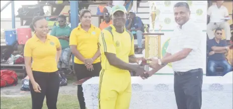  ??  ?? Essequibo skipper, Anthony Adams receives his title from GCB Secretary Anand Sanasie