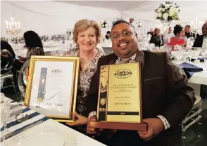  ??  ?? Carol du Preez (director) and Dinesh Naidoo (group operations director) of Serendipit­y Travel celebrate winning the top brand award in the Standard Bank KwaZulu-Natal top business awards function held at the Wavehouse in uMhlanga last night.