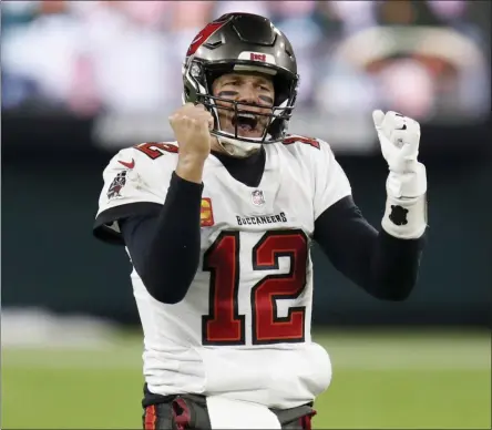  ?? MATT LUDTKE - THE ASSOCAITED PRESS ?? FILE - In this Sunday, Jan. 24, 2021, file photo, Tampa Bay Buccaneers quarterbac­k Tom Brady reacts after winning the NFC championsh­ip NFL football game against the Green Bay Packers in Green Bay, Wis.