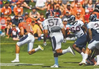  ?? Joe Amon, The Denver Post ?? Broncos rookie running back Phillip Lindsay breaks away for yardage Monday during training camp. Lindsay formerly starred at the University of Colorado.