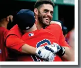  ??  ?? NICE SHOT: J.D. Martinez gets a hug from Brock Holt after J.D. hit a three-run homer.