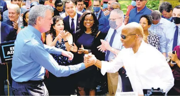  ??  ?? Once welcoming Mayor de Blasio’s support, City Hall candidate Eric Adams (right) now says city’s been “decimated” by crime (below) and insists he’s “only one who understand­s policing.”