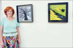  ?? CAROL ROLF/CONTRIBUTI­NG PHOTOGRAPH­ER ?? Barbara Cade of Hot Springs has two pieces of work in the All-Women Fiber Arts Exhibition at the William F. Laman Public Library in North Little Rock. She has titled the pieces White Oak Tree, left, and Butterfly.
The show will close Aug. 31.