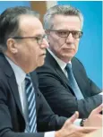  ?? AFP ?? German Interior Minister Thomas de Maiziere (R) and the head of Germany’s Office for Migration and Refugees FrankJuerg­en Weise give a press conference on Wednesday in Berlin. —