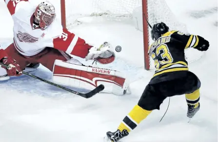  ?? CHARLES KRUPA/AP ?? Boston’s Brad Marchand scores past Detroit goalie Jared Coreau earlier this season. The 28-year-old Marchand has emerged as one of the top players in the NHL.