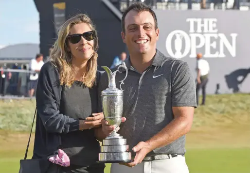  ?? AFP ?? Italy’s Francesco Molinari and his wife Valentina pose for pictures with the Claret Jug, the trophy at Carnoustie, Scotland on Sunday. —