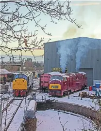  ?? MARTYN TATTAM ?? A snowy end to Severn Valley’s 2020 season: With snow on the ground on the afternoon of December 30, ‘Warship’ No. D821 Greyhound sends up plumes of exhausts by the turntable at Kiddermins­ter TMD. The ‘Warship’ was being ‘prepped’ for what would have been its last run of 2020. The county of Shropshire was placed into Covid-19 Tier 3 the following day, and the rest of the operating season’s services were cancelled. On the left is Class 40 No. 40106 Atlantic Conveyor.