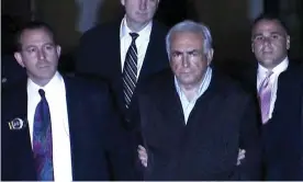  ??  ?? Dominique Strauss-Kahn, centre, is led from police custody to a New York court in 2011 in Room 2806: The Accusation. Photograph: Netflix