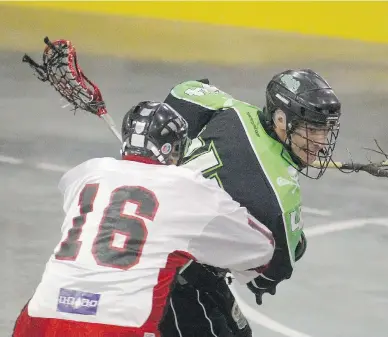  ?? RICK MACWILLIAM, EDMONTON JOURNAL FILES ?? Onondaga Redhawks Neal Powless, left, and St. Catharines Saints Mitch Dumont are shown during action at the Presidents Cup, national Senior B lacrosse championsh­ips, at Grant Fuhr Arena in Edmonton.