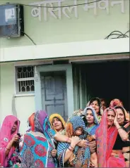  ?? Praveen Khanna ?? Bansal’s relatives outside his home Wednesday.