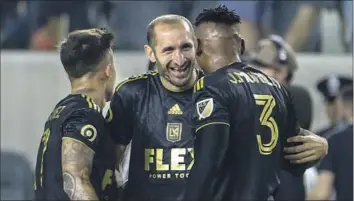  ?? Ringo H.W. Chiu Associated Press ?? GIORGIO CHIELLINI, center, and LAFC open the CONFACAF Champions League in Costa Rica against Alajuelens­e, and the veteran defender said succeeding in the competitio­n is an important goal for the club.
