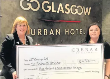  ??  ?? Wonderful reception Lorna McCafferty is presented with the £4900 cheque by Caitlin Casey