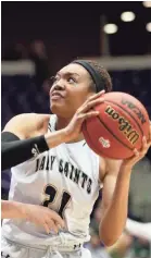  ?? MAX GERSH/THE COMMERCIAL APPEAL ?? Briarcrest’s Carlia Northcross (21) looks to shoot past Brentwood Academy on Friday during the Division II-AA semifinals at Lipscomb University’s Allen Arena in Nashville.