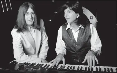  ??  ?? James Owen (left) portrays John Lennon with Tony Kishman as Paul McCartney in “Classical Mystery Tour,” performing with the South Arkansas Symphony Saturday in El Dorado.