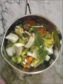  ?? PHOTO BY CATHY THOMAS ?? When you’re done with a rotisserie chicken, you can put its carcass in a saucepan with tomato paste, onion, carrots, garlic cloves, a basil leave and a few sprigs of parsley and heat it overnight to make chicken stock.