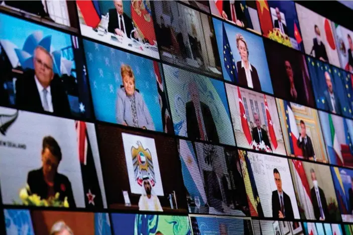  ??  ?? World leaders are seen on a screen during a climate change virtual summit from the East Room of the White House campus April 22, 2021, in Washington, DC. Photograph: Brendan Smialowski/AFP/Getty Images