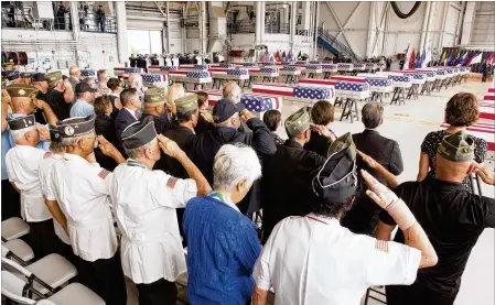  ?? KAT WADE/GETTY IMAGES ?? Servicemen and women representi­ng many branches of the military salute as the presumed remains of U.S. soldiers are brought to Joint base Pearl Harbor Hickam on Wednesday in Honolulu, Hawaii.