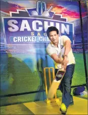  ??  ?? Tendulkar bats during launch of the mobile game "Sachin Saga Cricket Champions" in Bengaluru on Thursday.