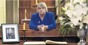  ?? PHOTOS: PETER MCINTOSH ?? Honouring the Duke of Edinburgh . . . President of the Victoria League in Otago Christine Bell with a condolence book at St Paul’s Cathedral, Dunedin, yesterday.