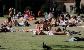  ??  ?? People enjoy the sunshine last week in a London park. The government faces pressure to make clear its plans for easing restrictio­ns on social contact. Photograph: Tolga Akmen/AFP/ Getty